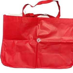 Lulu Lemon tote bags 1-small white, 1-small black & 1 large red.